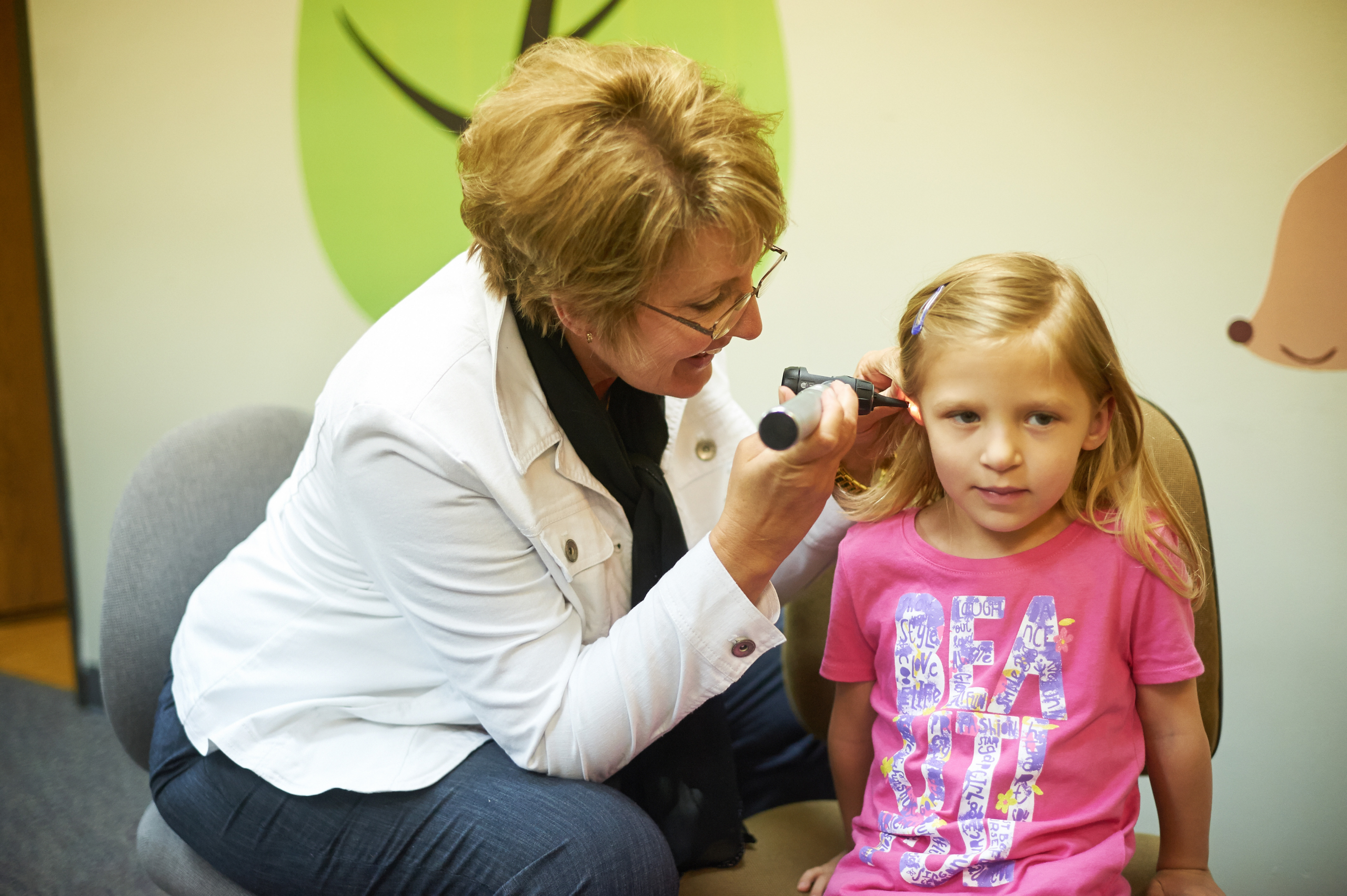 Northwest AEA employee conducting a hearing test